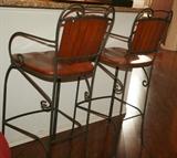 2 wood and iron bar chairs