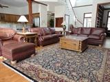 Bradington Young ( North Carolina Made) Leather Sofas with matching side chair and Ottoman. Oriental Rug is 9x17 