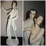 A porcelain cast by Giuseppe Armani depicting a man and woman dancing, entitled "Tango Coyle". It is hand painted with a 7" by 5" base and standing 19" high.