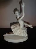 A piece from Edward Marshall Boehm's "Ballet Classics" collection entitled "The Firebird." This piece depicts a ballerina in mid action and is 7" high by 7" long by 4" deep.