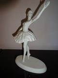 A piece from Edward Marshall Boehm's "Ballet Classics" collection entitled "Coppelia." This piece depicts a ballerina in mid action and is 10" high by 7" long by 4" deep.
