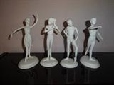 This a set of 4 vintage porcelain pieces from the "Royal Ballet" series by Brenda Naylor. Depicting young ballerinas, they are called, in sequence, "Testing Points," "Epaule," "Braiding Hair," and "Efface!" Each stands at 8" high by 4" long by 3" wide. Sold as Set Only