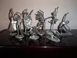 This set of eight pewter dancers are all numbered editions by Bodris. Six of the pieces are 7" high by 4" long by 2" wide and two stand 3" high by 2" long by 2" wide. Sold as Set Only