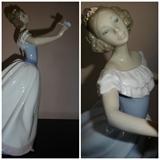 A hand painted porcelain piece by Lladro entitled "Woman with Butterfly." Depicting a woman in white and blue holding a buttefly in blue and pink. From 1996, this piece stands 12" high by 7" long by 6" wide.
