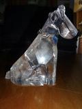 A Glass sculpture entitled "Scottie" depicts a rough cut Scottish terrier in glass. It stands 5" high by 4" long.