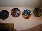 Photo 2 of 2: A set of 11 out of 12 collectors plates depicting sorcerers and dragons. They are 8.5" in diameter and show scenes of sorcerers and dragons interacting in various fantasy settings.
