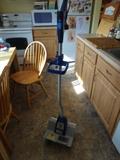"Snow Joe" electric snow thrower model # 322P and 54" high by 12" wide and 8" deep.
