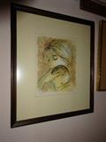 A limited print by Coty number 253 of 275 depicting a mother and child in ink and wash. The black frame is 15.5" by 18"