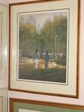 Print depicting a boy and girl walking in the park away from the viewers perspective. They are holding hands. The print is in a 30" by 25" frame.