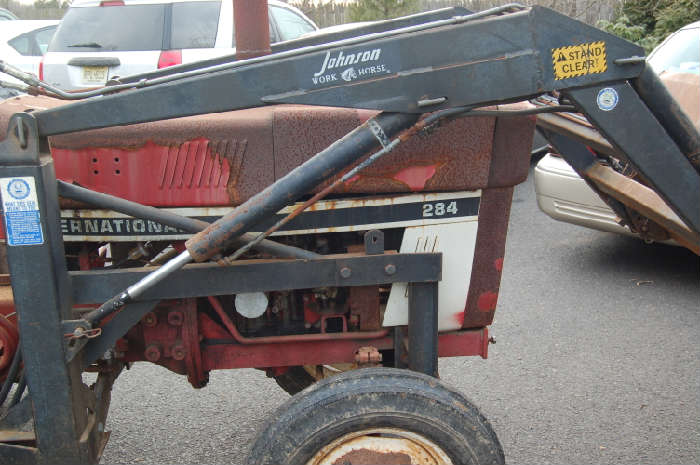 International Harvester 284 Tractor and attachments.