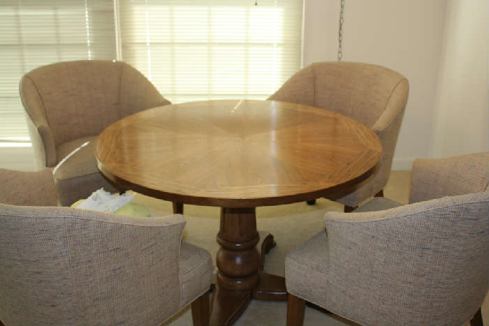 TABLE SET WITH 4 BARREL CHAIRS ON CASTERS