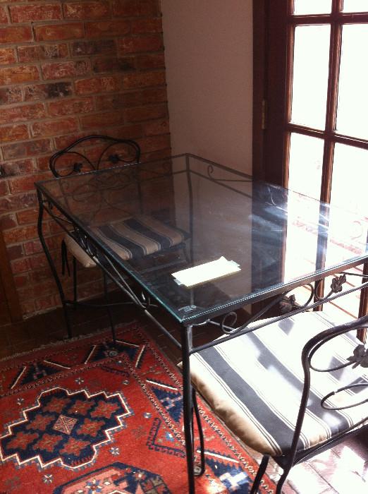 Black rectangular glass top table (patio or inside- from 1950's) and 4 chairs with rust proof finish 
