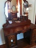                 Antique dresser with unique mirrors