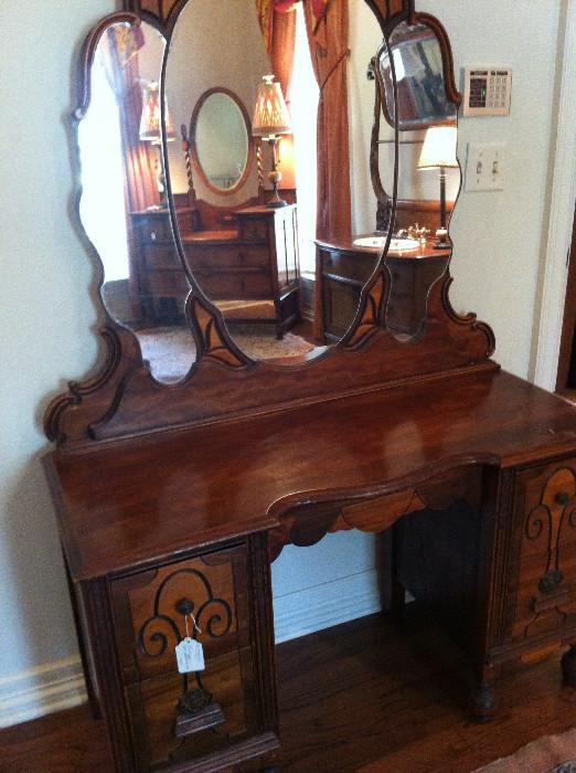                 Antique dresser with unique mirrors