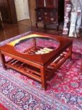 Glass top coffee table along with a great rug selection