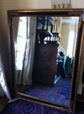                    Large black & gold framed mirror