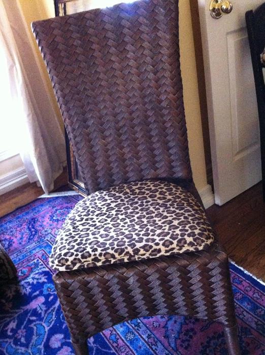                   Rattan chair with leopard cushion