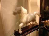 Jade horse on stand.
