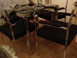 Chrome and glass game or small dining table and chairs. No signature located but you can help look for one.