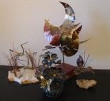 A few of the mid century metal art pieces for table top as well as wall to be found in the sale. All are in excellent condition