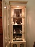 White washed curio cabinet is small scale and will fit almost any place