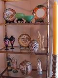 Selection of collectible glass and porcelain items. Black vases are by Carlton Ware. Green glass in the "jade" color. 1930's plates and biscuit barrel. New Asian figurines and covered jar.