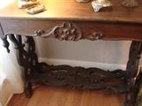 Unusual oak table with decorative self. Both finials are intact, which is unusual for this style.