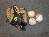 11 1/2 Wilson genuine leather baseball glove and 3 baseballs