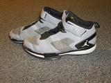 Grey and black size 12 Jordan basketball shoes