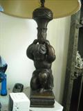Pr. of Antique Carved Lamps (secret drawer in each)
Vase shaped stem is supported by the kneeling figure of a putto
Possibly Flemish, 17th century
Shades not included