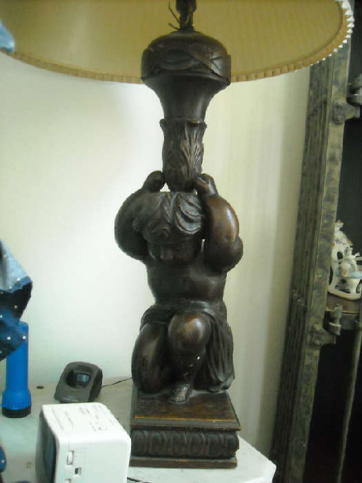 Pr. of Antique Carved Lamps (secret drawer in each)
Vase shaped stem is supported by the kneeling figure of a putto
Possibly Flemish, 17th century
Shades not included