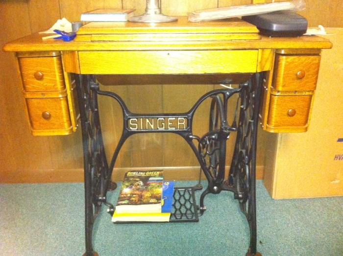 Beautifully refinished Singer treadle sewing machine.