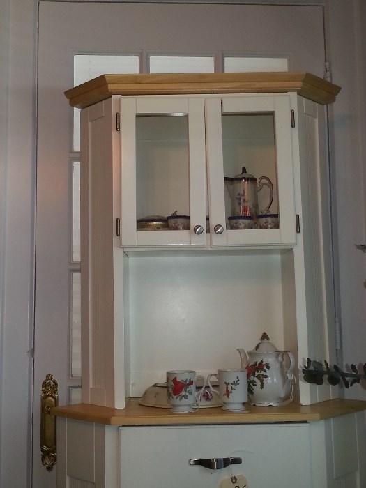 Free standing white cabinet.
