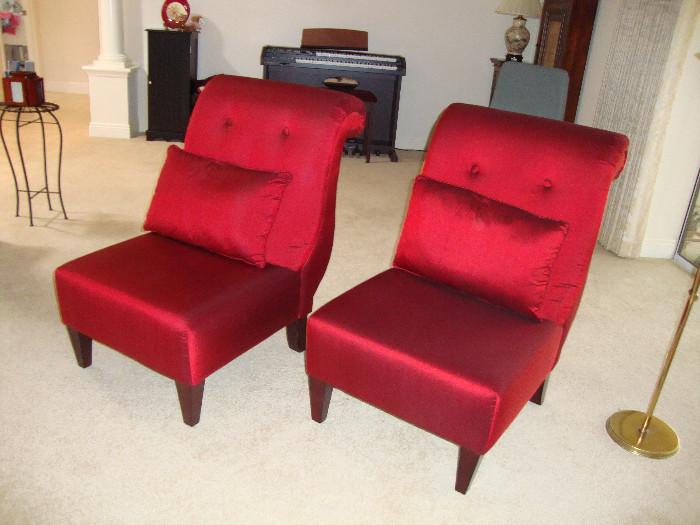 Pair of custom slipper chairs, covered in red silk