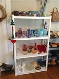 More colorful glass including pale blue & red "crinkle" goblets by Morgantown, carnival glass, Fenton, hobnail milk glass + signed art glass by Pat Davidson, James Alloway & others (on top shelf)