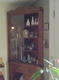 Corner cupboard with sliding glass doors