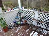 Yard art including glass gazing balls & plant stands