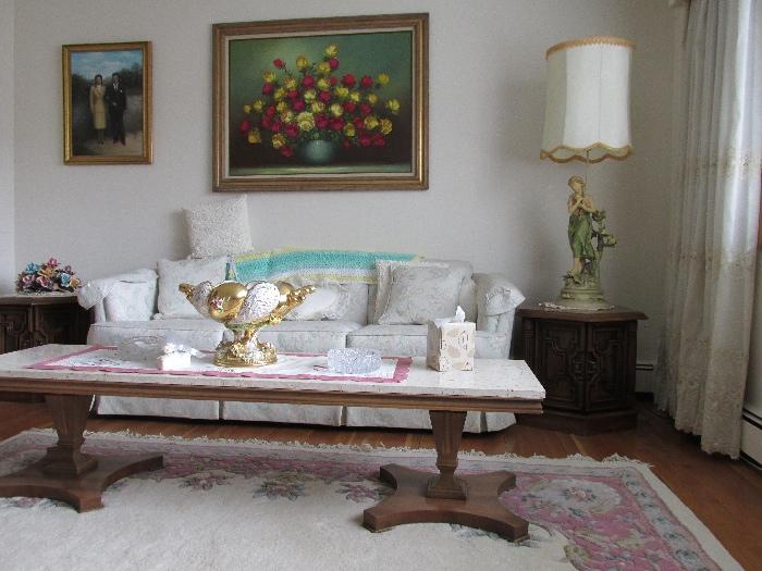 Couch, marble top table, end table, lamp, paintings