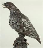Jean Doyle, South African, b. 1930, Eagle Standing on Tree Trunk, bronze