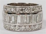Lot#42, 3.85CT DIAMOND, 3 ROW GOLD BAND, SIZE 7.25//14kt white gold band, featuring three rows of diamonds, including a center channel set baguette diamond row, flanked by two rows of inset round diamonds, measuring 3.85 carats in total. The diamonds have a total approximate weight of 9.9 grams, size 7.25.