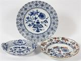 Lot#61, MEISSEN LATTICE BORDER PORCELAIN PLATE, OVAL PLATE AND DEEP SOUP BOWL 3 PCS.includes one plate with lattice border with flower design, 10" Dia.; one oval dish with lattice border and flower design, 8" x 6" and one deep soup bowl with blue onion and orange floral highlights, 9" Dia. Having 'Meissen' inscribed in circle on undersides.