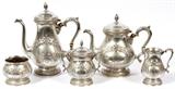 Lot#1019, ROGERS STERLING TEA & COFFEE SET, FIVE PIECES//Hand-chased sterling silver set includes 1 teapot, H.9", 1 coffee pot, H.11", 1 creamer, 1 covered sugar bowl, and 1 waste bowl; each piece is marked "Rogers Sterling Hand Chased."  Totaling approximately 80.2 troy oz.