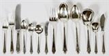 Lot#1027, TOWLE 'VIRGINIA CARVEL' STERLING FLATWARE SET, 92 PIECES (SERVICE FOR ELEVEN)Sterling silver flatware service includes 12 place knives, L.8 3/4", 11 place forks, L.7 1/4", 13 salad forks, 12 bouillon spoons, 13 butter spreaders, 12 ice cream forks, and 11 teaspoons, as well as 2 serving spoons, L.8 1/2", 2 serving spoons, L.8 3/4", 1 cold meat fork, 1 master butter knife, 1 serving spoon, L.7 1/2", and 1 sugar spoon; each is engraved with a Gothic "M" initial at the tip. Totaling approximately 79.7 troy oz.
