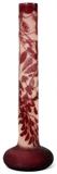 Lot#1037, GALLE CAMEO GLASS FLOOR VASE, EARLY 20TH C., H 30"Elongated cylindrical neck carved with an encircling floral and leaf branch in purple cameo on a light pink ground, signed "Galle" just above the flared base.