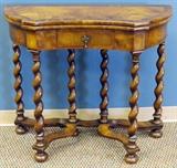 Lot#1074,WILLIAM & MARY STYLE BURL WALNUT FLIP-TOP TABLE, H 29", W 34"Having an inset needlepoint top, decorated in floral bouquets. Raised on barley twist form legs, with a curved lower stretcher. Fitted with a single drawer. Property from the Estate of Elmore Leonard, Bloomfield Hills, MI.