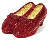 Lot#1128, KATHRINE BAUMANN 'CLICK YOUR HEELS' MINAUDIERE, 1998, W 5"Full bead red ruby and gold crystal heels, cabochon push button opening to gold leather lining. Stamped: Katherine Baumann Collectibles, Beverly Hills, 60/250. Titled and dated along interior edge. Measures W. 5" x 2 1/2" (23" to the chain shoulder strap).