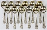 Lot#1316, DURGIN DIV. OF GORHAM 'IRIS' STERLING BOUILLON SOUP SPOONS, SET OF TWELVE, L 5 1/2"Each sterling silver spoon is engraved with a Gothic initial at the tip; retailed by Wright, Kay &Co.  Totaling approximately 13.1 troy oz.