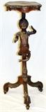Lot#2266, ITALIAN ROCOCO STYLE CARVED WALNUT FIGURAL PEDESTAL, 19TH C., H 37", W 13", D 12"Tall pedestal base with boy form shaft carved almost in the round; scalloped, scroll footed splayed legs.