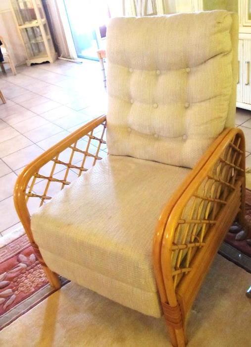 Vintage Rattan Recliner with natural finish, neutral colored upholstery and tufted back