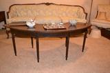 Antique sofa and unusual curved coffee table
